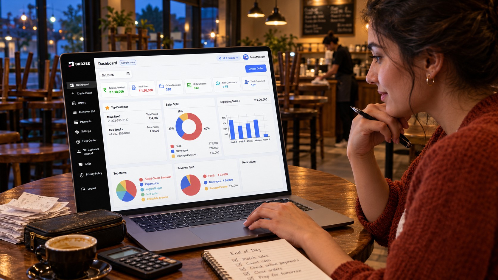 Cafe owner reviewing sample Darzee sales dashboard during an end-of-day check
